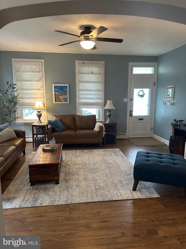 313 E Cherry St, Palmyra, PA 17078 - living area with a baseboard heating unit, a ceiling fan, baseboards, and wood finished floors