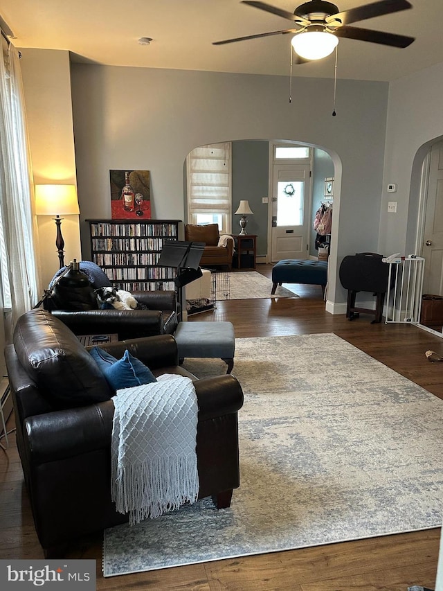 313 E Cherry St, Palmyra, PA 17078 - living room with arched walkways, ceiling fan, and wood finished floors
