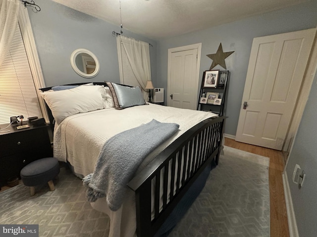 313 E Cherry St, Palmyra, PA 17078 - bedroom with wood finished floors, a closet, and baseboards