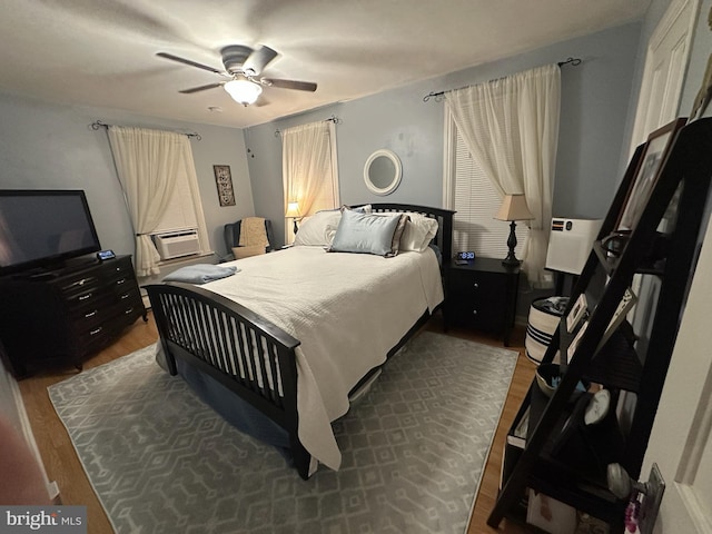 313 E Cherry St, Palmyra, PA 17078 - bedroom with wood finished floors, ceiling fan, and cooling unit