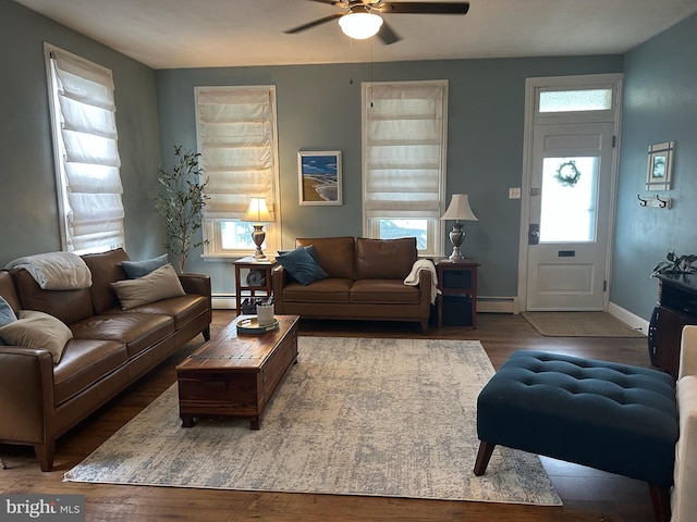 313 E Cherry St, Palmyra, PA 17078 - living area with a ceiling fan, plenty of natural light, wood finished floors, and baseboard heating