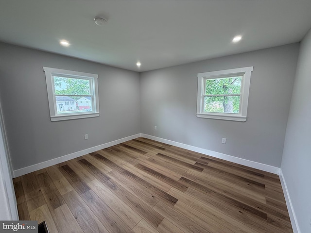8110 Manson St, Landover, MD 20785 - empty room featuring plenty of natural light, wood finished floors, baseboards, a smoke detector, and recessed lighting