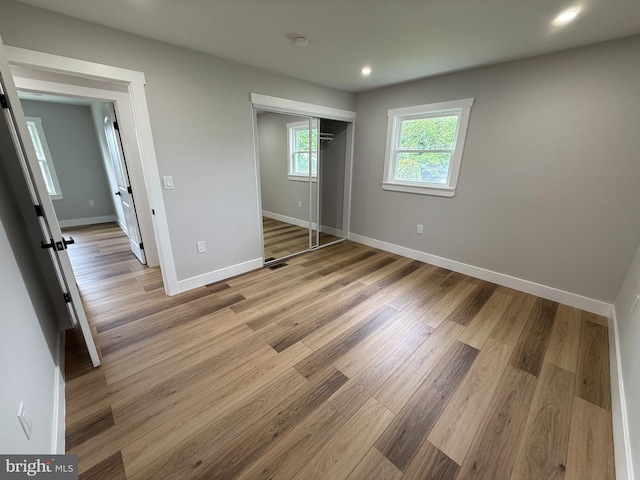 8110 Manson St, Landover, MD 20785 - unfurnished bedroom featuring baseboards, light wood-type flooring, a closet, and recessed lighting