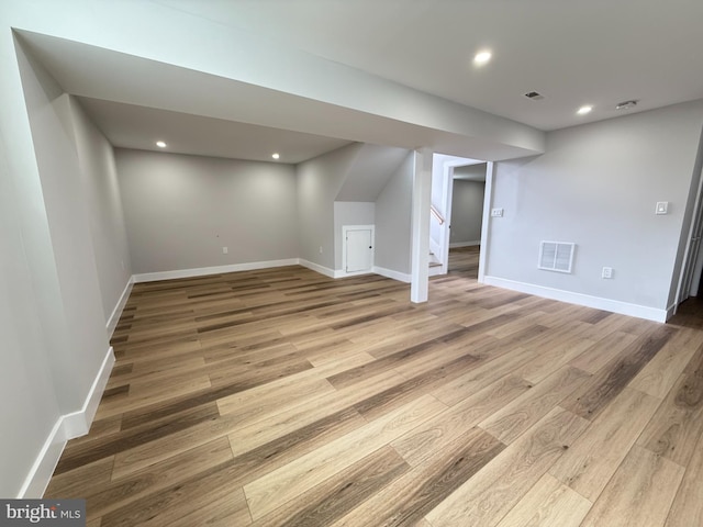 8110 Manson St, Landover, MD 20785 - finished basement with wood finished floors, stairs, recessed lighting, and baseboards