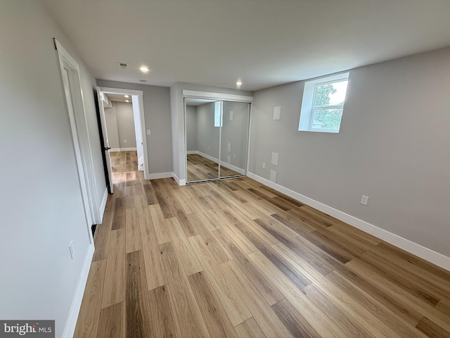 8110 Manson St, Landover, MD 20785 - unfurnished bedroom featuring light wood-style flooring, recessed lighting, baseboards, and a closet