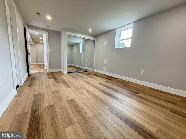 8110 Manson St, Landover, MD 20785 - unfurnished bedroom with light wood-style floors, a closet, baseboards, and recessed lighting