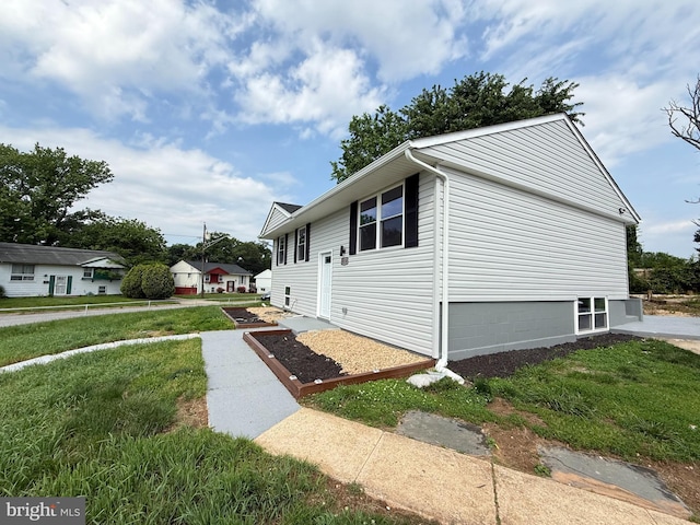 8110 Manson St, Landover, MD 20785 - view of property exterior with a lawn