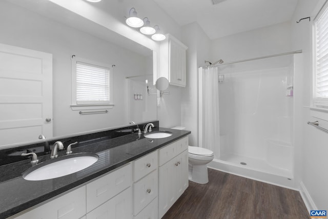 6169 Community House Rd, Columbia, VA 23038 - bathroom with curtained shower, wood finished floors, healthy amount of natural light, and toilet