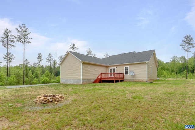 6169 Community House Rd, Columbia, VA 23038 - back of property with a deck, a lawn, and a shingled roof