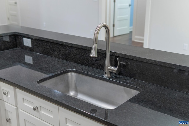 6169 Community House Rd, Columbia, VA 23038 - kitchen view of a sink, white cabinets, and dark stone countertops