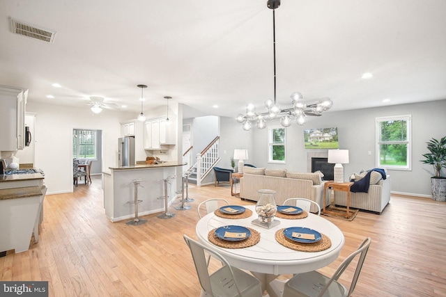 34637 Megan Ct, Lewes, DE 19958 - dining area featuring light wood finished floors, recessed lighting, ceiling fan, stairway, and baseboards