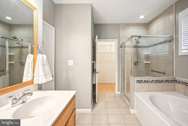 34637 Megan Ct, Lewes, DE 19958 - bathroom featuring a shower stall, vanity, a bath, tile patterned floors, and a spacious closet
