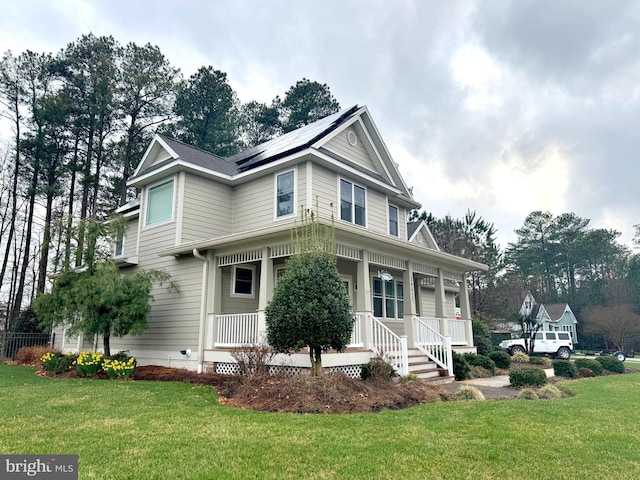 34637 Megan Ct, Lewes, DE 19958 - victorian home with a porch, a front lawn, and roof mounted solar panels