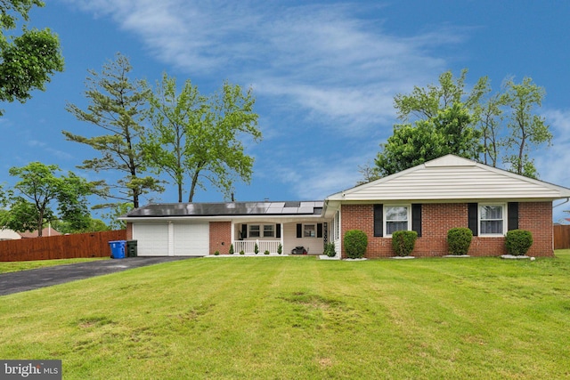 76 Torrington Ln, Willingboro, NJ 08046 - ranch-style house featuring a porch, an attached garage, driveway, and brick siding