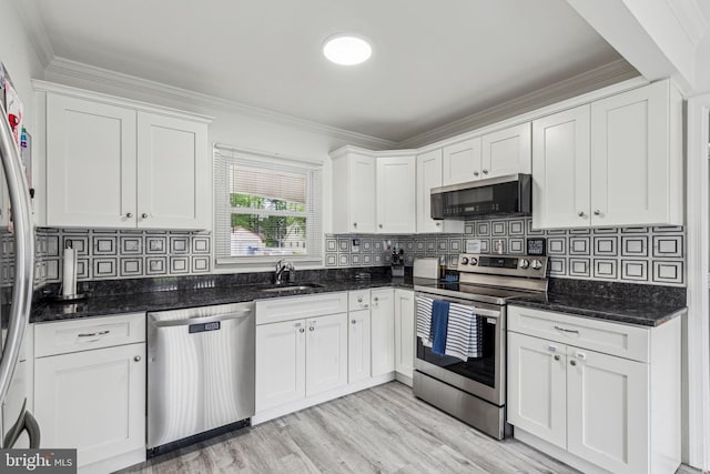 76 Torrington Ln, Willingboro, NJ 08046 - kitchen featuring appliances with stainless steel finishes, a sink, white cabinetry, crown molding, and backsplash
