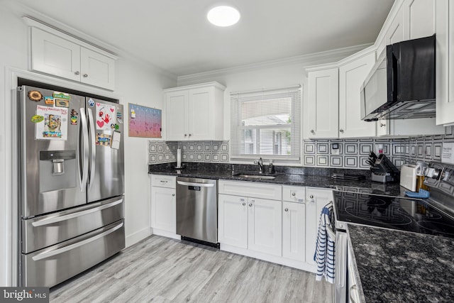 76 Torrington Ln, Willingboro, NJ 08046 - kitchen featuring appliances with stainless steel finishes, a sink, ornamental molding, white cabinetry, and light wood finished floors