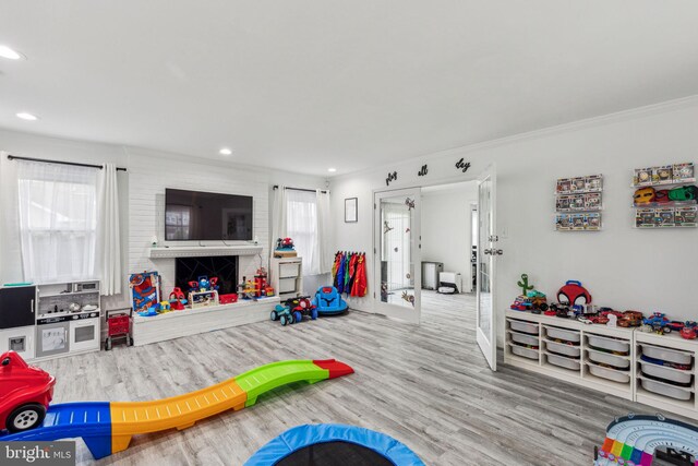 76 Torrington Ln, Willingboro, NJ 08046 - recreation room with wood finished floors, ornamental molding, recessed lighting, baseboards, and french doors