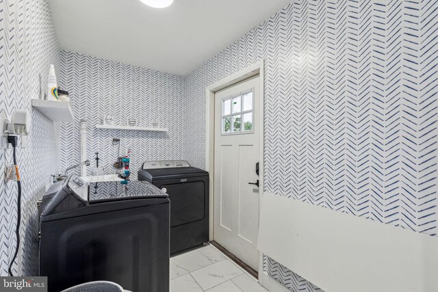 76 Torrington Ln, Willingboro, NJ 08046 - laundry room with wallpapered walls, washer and clothes dryer, and light marble finish flooring
