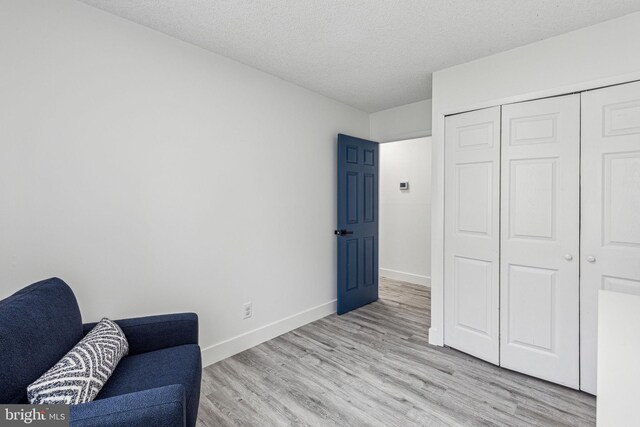 76 Torrington Ln, Willingboro, NJ 08046 - living area with light wood finished floors, baseboards, and a textured ceiling