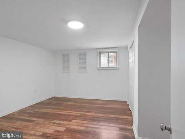 4102 Elizabeth St, Rockville, MD 20853 - basement featuring wood finished floors, built in shelves, and baseboards