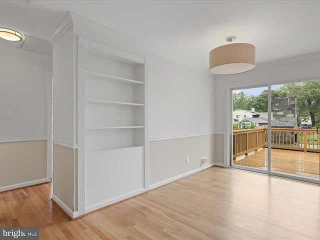 4102 Elizabeth St, Rockville, MD 20853 - unfurnished room featuring attic access, built in features, wood finished floors, ornamental molding, and baseboards
