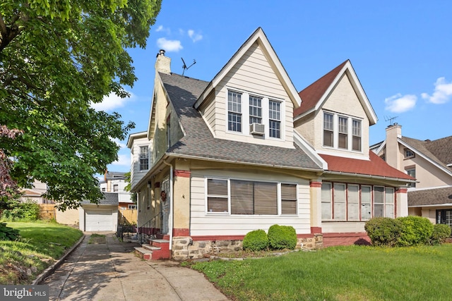 917 Foulkrod St, Philadelphia, PA 19124 - view of front facade with an outbuilding, a chimney, a garage, a front lawn, and concrete driveway