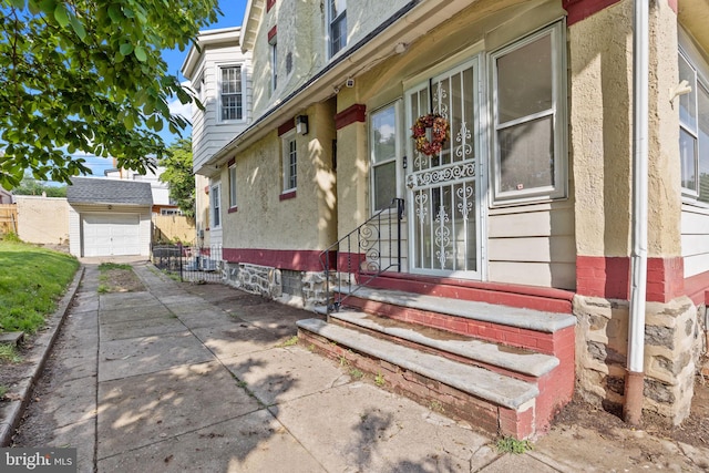 917 Foulkrod St, Philadelphia, PA 19124 - doorway to property with driveway, fence, and stucco siding