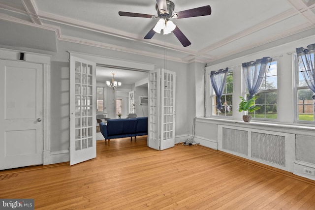 917 Foulkrod St, Philadelphia, PA 19124 - unfurnished room with radiator, light wood-style flooring, crown molding, french doors, and ceiling fan