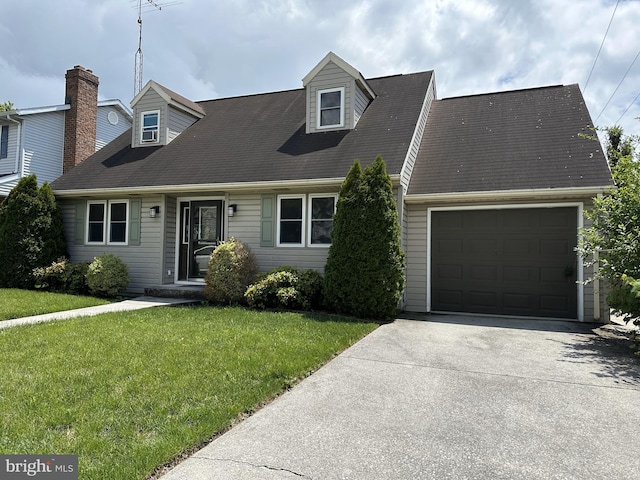 514 Hartman Ave, Hanover, PA 17331 - cape cod home with an attached garage, a front lawn, and driveway