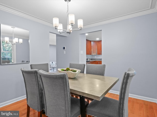 2934 Everleigh Way, Fairfax, VA 22031 - dining space with a chandelier, light wood-style flooring, crown molding, and baseboards