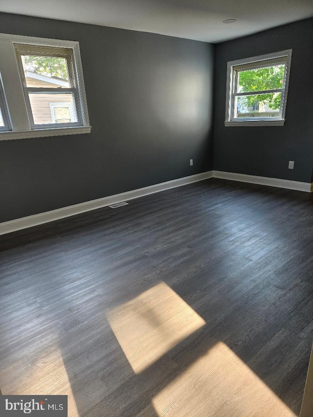 108 Thomson Ave, Paulsboro, NJ 08066 - spare room featuring dark wood-type flooring and baseboards