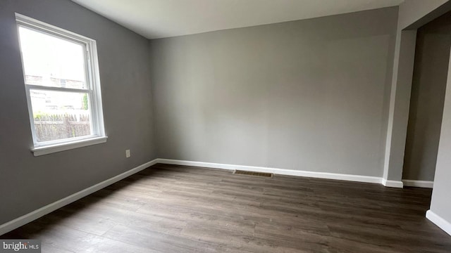 1206 Morton Ave, Chester, PA 19013 - empty room with dark wood finished floors and baseboards