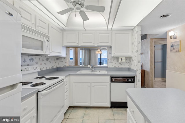 605 Chesapeake House Rd Unit 605N, Bethany Beach, DE 19930 - kitchen with white appliances, a sink, white cabinets, ceiling fan, and wallpapered walls