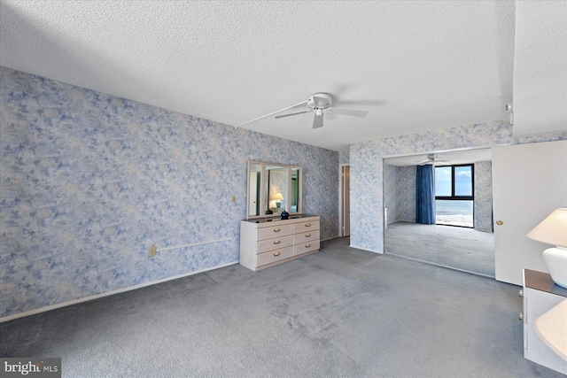 605 Chesapeake House Rd Unit 605N, Bethany Beach, DE 19930 - unfurnished bedroom with wallpapered walls, a textured ceiling, and a ceiling fan
