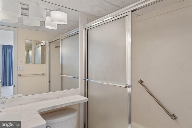 605 Chesapeake House Rd Unit 605N, Bethany Beach, DE 19930 - bathroom featuring a shower with shower door, toilet, and vanity