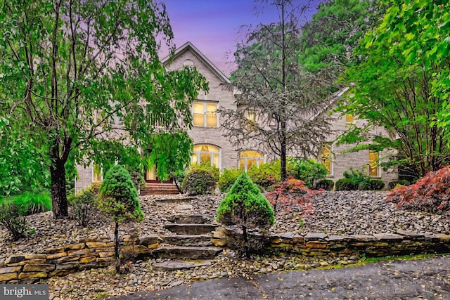 view of front of house featuring brick siding
