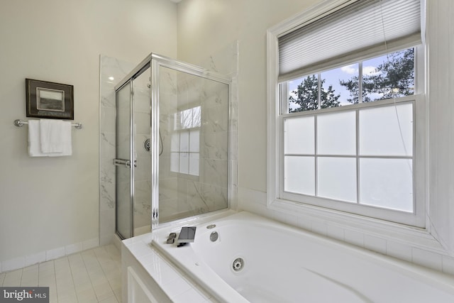 4714 Major Ct, Alexandria, VA 22312 - bathroom featuring a jetted tub, a stall shower, healthy amount of natural light, and tile patterned flooring