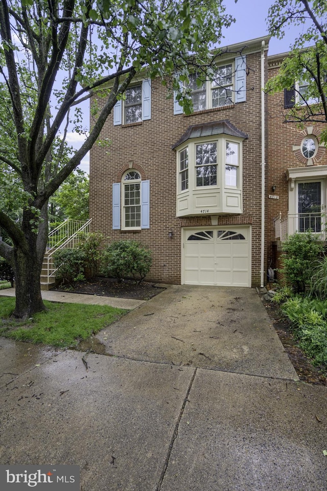 4714 Major Ct, Alexandria, VA 22312 - view of front of property with an attached garage, driveway, and brick siding