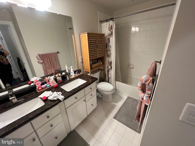 bathroom with tile patterned flooring, double vanity, toilet, and shower / bath combo with shower curtain