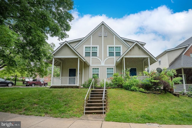 3724 Merrick Rd, Philadelphia, PA 19129 - english style home featuring covered porch, stucco siding, a front lawn, and stairway