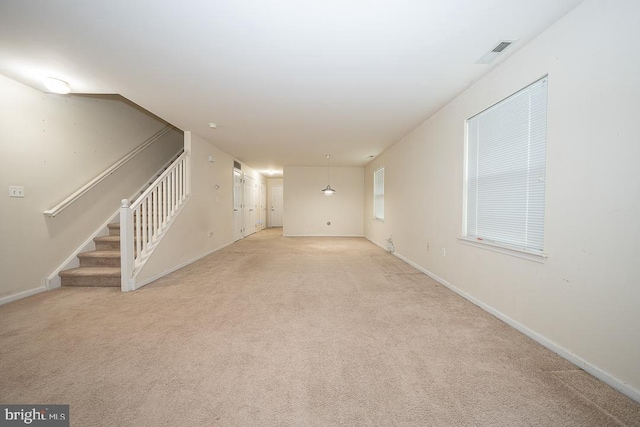 3724 Merrick Rd, Philadelphia, PA 19129 - unfurnished living room with light carpet, stairs, and baseboards