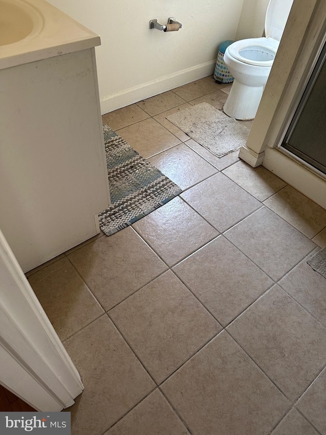 1844 W Master St, Philadelphia, PA 19121 - bathroom featuring tile patterned floors, a sink, baseboards, and a shower with door