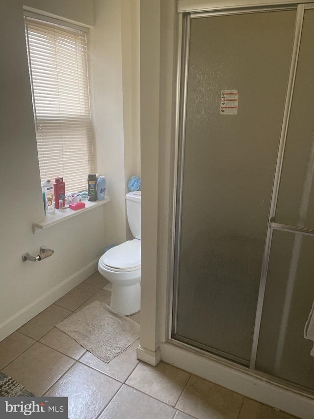 1844 W Master St, Philadelphia, PA 19121 - full bath with tile patterned flooring, a shower stall, toilet, and baseboards