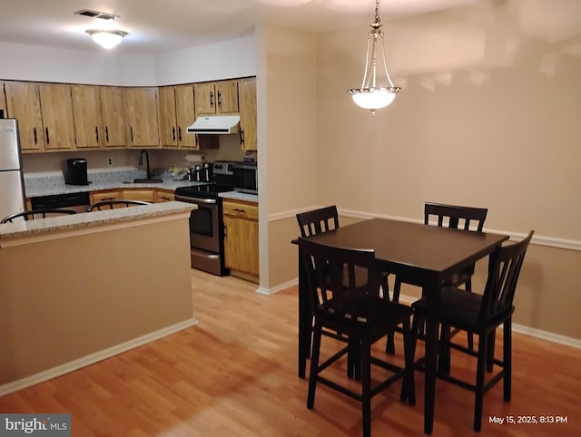 28B W Bluebell Ln, Mount Laurel, NJ 08054 - kitchen with stainless steel electric stove, extractor fan, a sink, and light wood finished floors