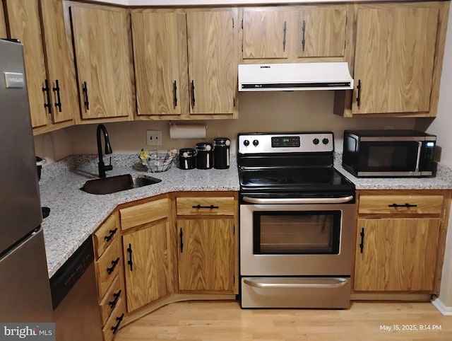 28B W Bluebell Ln, Mount Laurel, NJ 08054 - kitchen with range hood, appliances with stainless steel finishes, a sink, and light wood finished floors