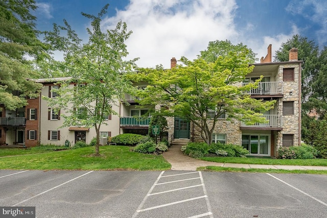 262 Drummers Ln Unit 262, Wayne, PA 19087 - view of building exterior featuring uncovered parking