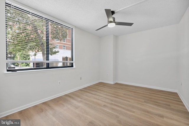 3830 9th St N Unit 110W, Arlington, VA 22203 - unfurnished room with a textured ceiling, light wood-style floors, and a ceiling fan