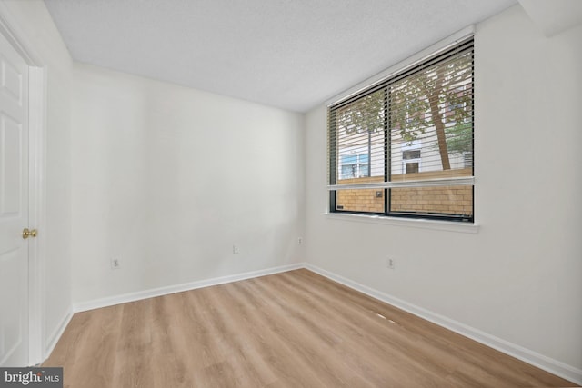 3830 9th St N Unit 110W, Arlington, VA 22203 - unfurnished room featuring wood finished floors and baseboards