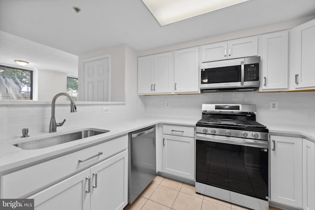 3830 9th St N Unit 110W, Arlington, VA 22203 - kitchen with stainless steel appliances, decorative backsplash, and white cabinets