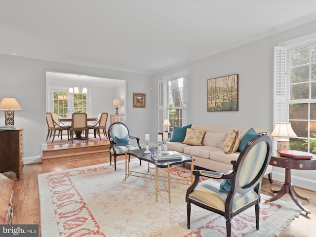 7287 Evans Mill Rd, Mclean, VA 22101 - living room with ornamental molding, wood finished floors, a chandelier, and baseboards
